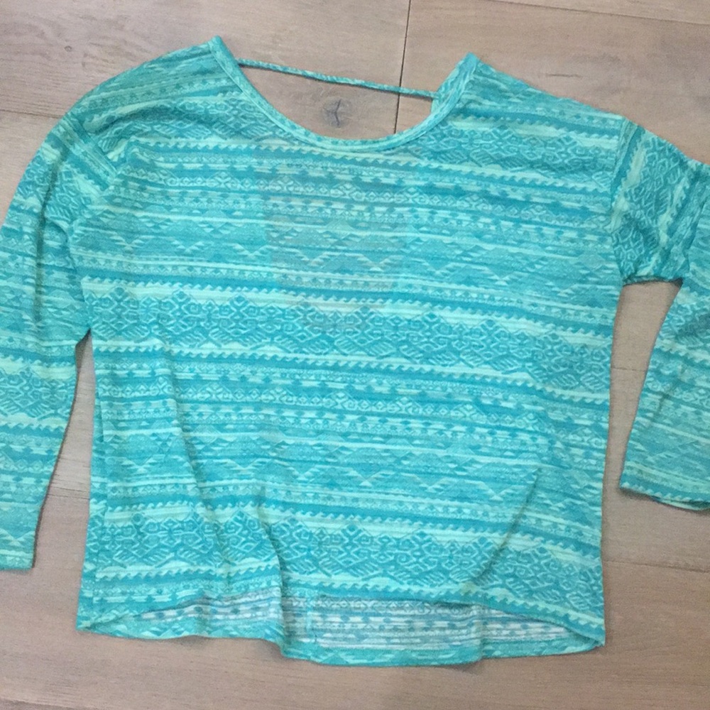 teal sweater with open back